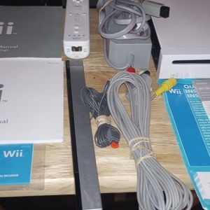 Nintendo Wii complete with manual cords controller and sensor bar